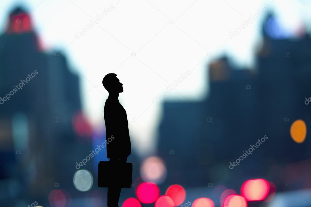 Silhouette of businessman holding a briefcase