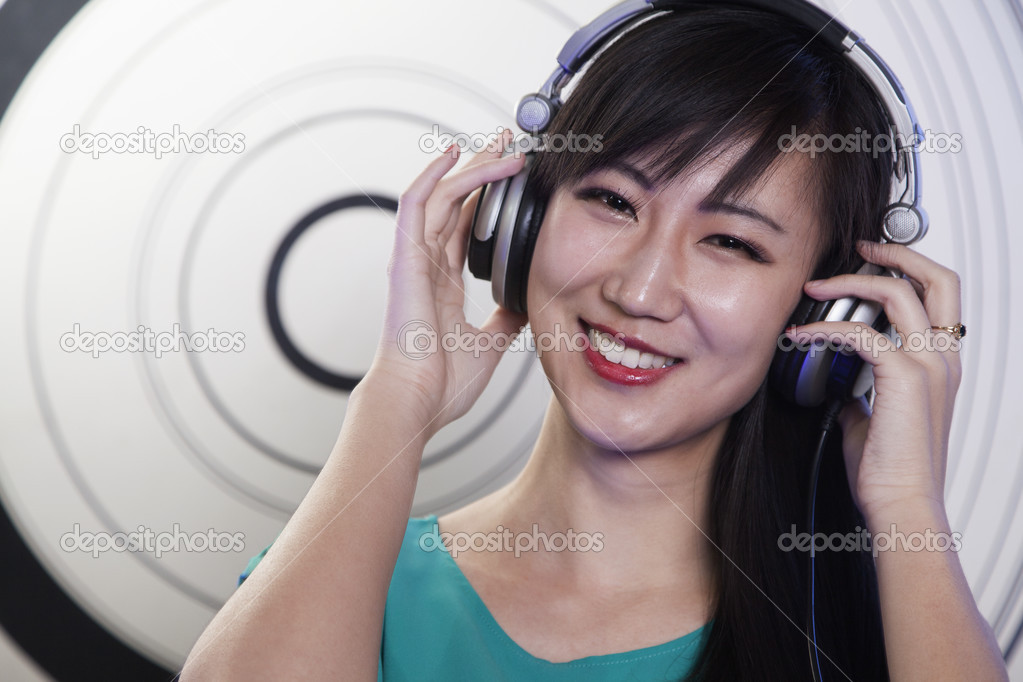 Female DJ playing music in a nightclub