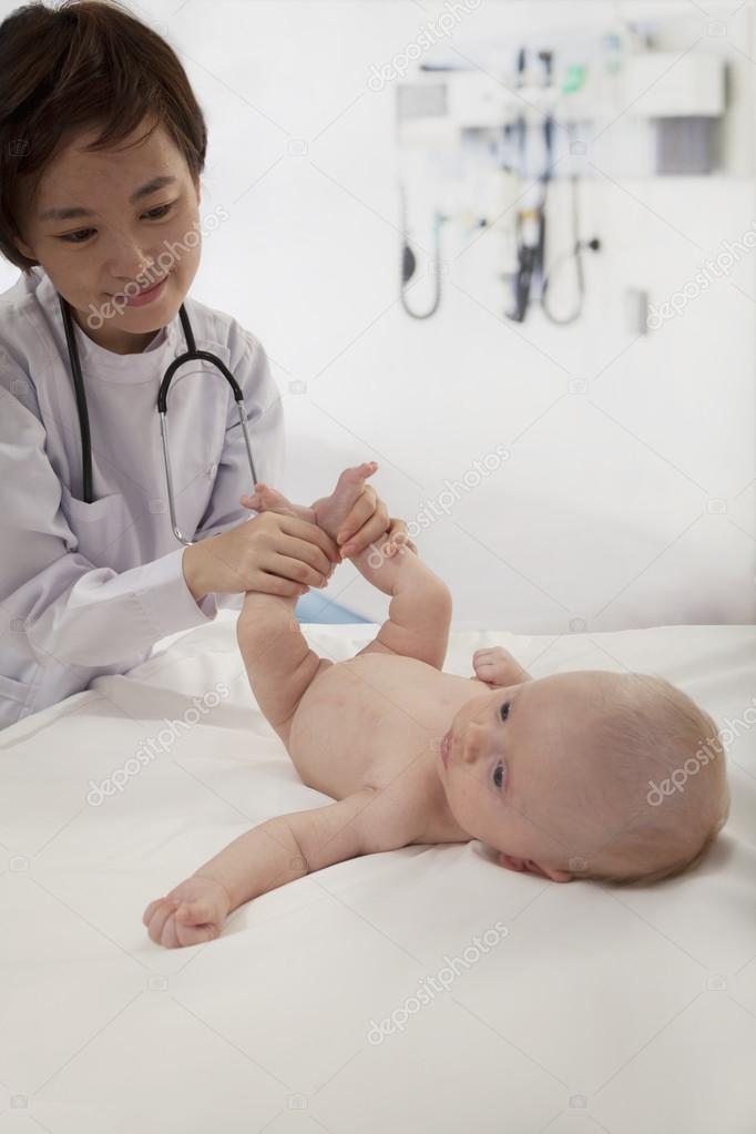 Doctor examining a baby in the doctors office