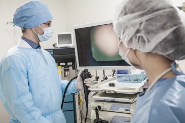 Surgeons preparing for surgery clipart