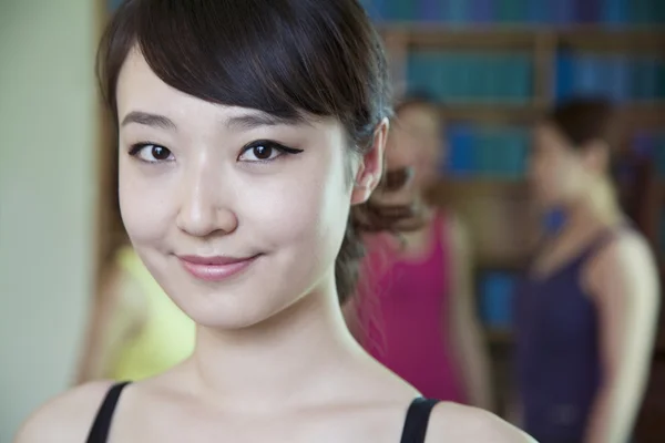 Young woman in a yoga studio — Stock Photo, Image