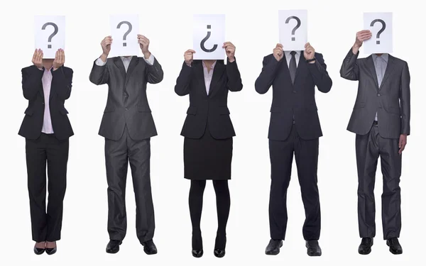 Business people holding up paper with question mark — Stock Photo, Image