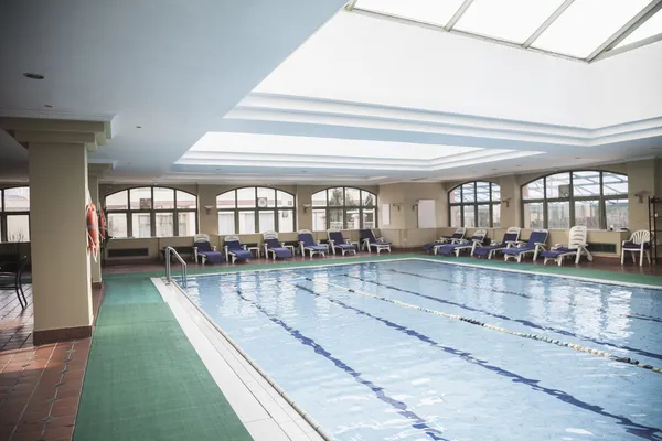 Large, indoor swimming pool with skylight — Stock Photo, Image