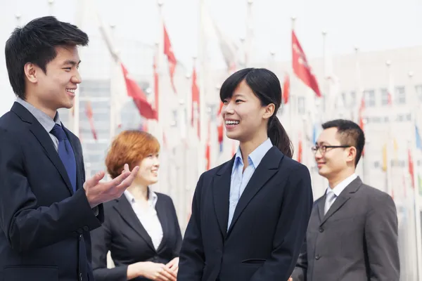 Business people talking outdoors — Stock Photo, Image