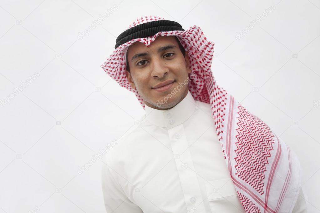 Teenage boy in traditional Arab clothing