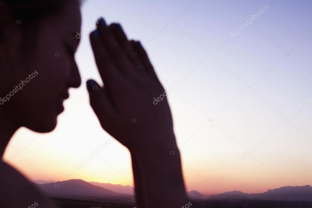 Woman hands together in prayer pose