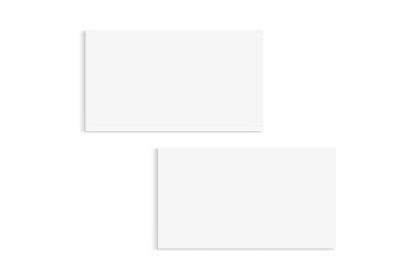 Two white business cards isolated on a white background. Includes a clipping path to make it easy to add your designs to the cards.