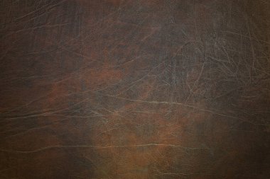 High angle view of an aged brown leather background.