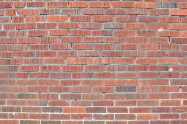 Detail of rough red brick wall.