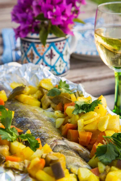 Baked sea bass with vegetables and curcuma — Stock Photo, Image