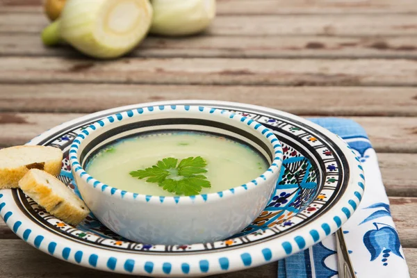 Fennel cream soup in the traditional tunisian plate — Stock Photo, Image