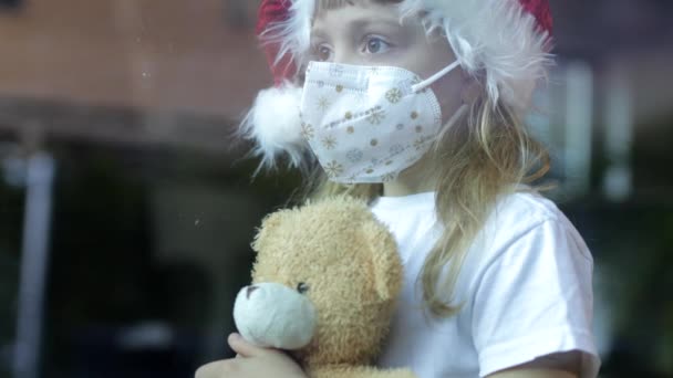 Girl Six Years Old Santa Hat Sits Table Alone Teddy — Stock Video