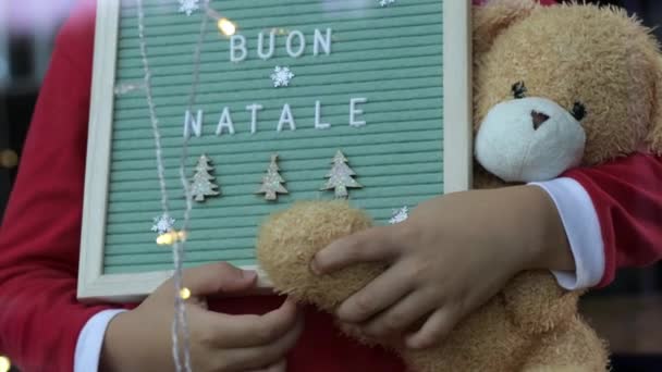 Boy Holding Holiday Wooden Frame Teddy Bear Home Christmas Time — Stockvideo