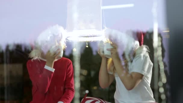 Two Kids Wearing Christmas Hats Sitting Drinking Tea Home Christmas — Stock Video