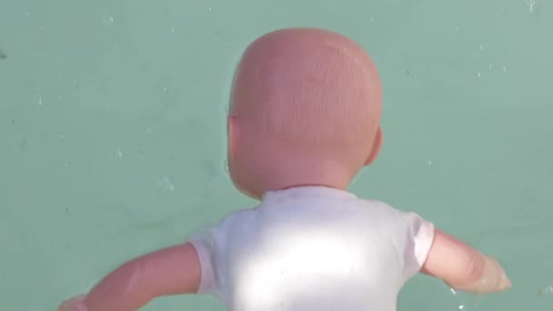 Toy Doll Floating Water — Stock Video