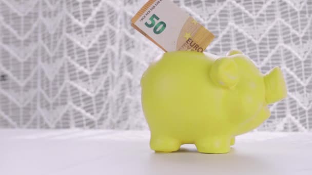 Euro Banknote Yellow Piggy Bank Closeup High Quality Footage — Stock video