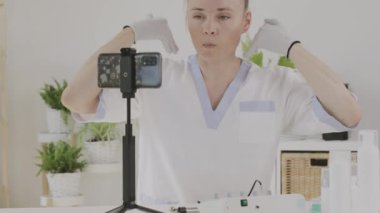 Female cosmetologist is giving online consultation. 