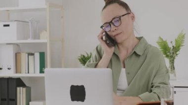 Young female discovers a sad story on phone.