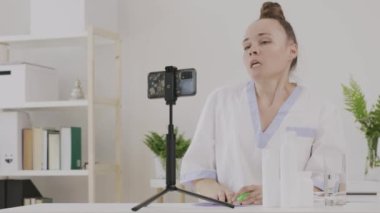 Female cosmetologist is giving online consultation. 