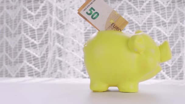 Euro Banknote Yellow Piggy Bank Closeup High Quality Footage — Stock video