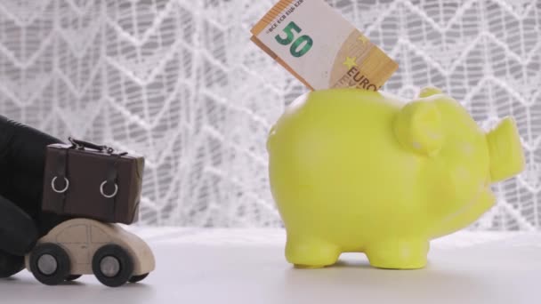 Euro Banknote Yellow Piggy Bank Wooden Car Luggage Closeup — Stock Video