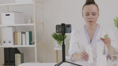 Female cosmetologist is giving online consultation. 