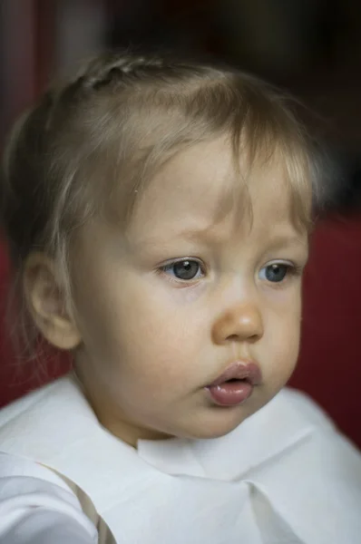 Serious concentrated  little girl shallow depth of field — Stock Photo, Image