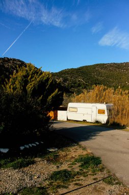 abandoned mobile home on the seashore in summer time