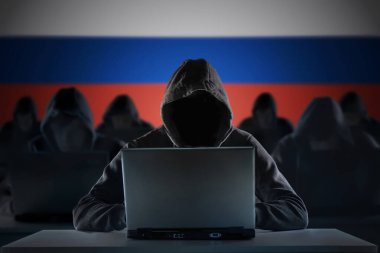 Many russian hackers in troll farm. Cyber crime and security concept. Russia flag in background. clipart
