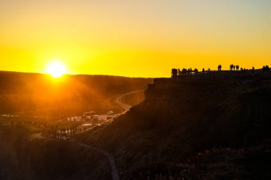 Gotorphoss morning and people silhouette. Shooting Location: Iceland