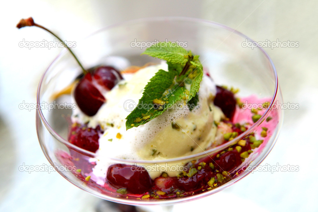 Ice cream with cherries in a glass