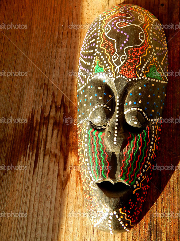African mask on wood background ⬇ Stock Photo, Image by