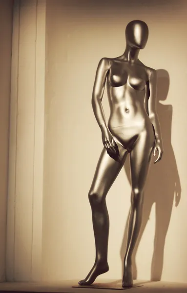 Golden mannequin in the form of a sexy woman — Stock Photo, Image