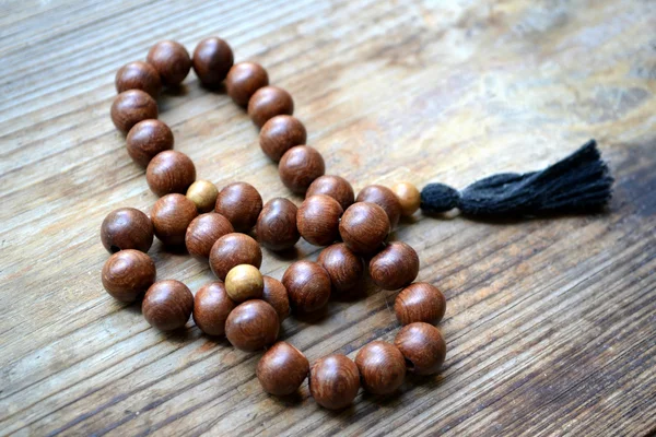 Perline rosario in legno marrone Fotografia Stock