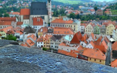 View of Cesky Krumlov city and an old pavement with the date 1868 clipart
