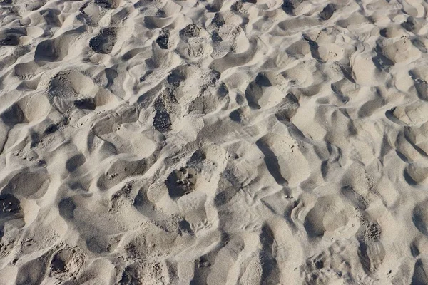 Zand met voetafdrukken — Stockfoto