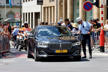 Black BMW car bringing dignitaries to Luxembourg National day parade. Luxembourg, Luxembourg - June 23, 2022. Selective focus