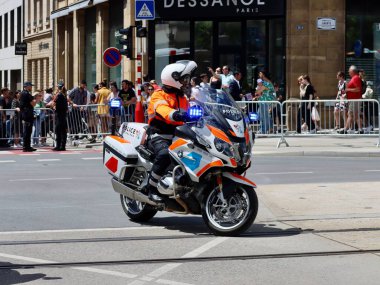 Police motorcycle driving to National day parade. Luxembourg, Luxembourg - June 23, 2022. Selective focus