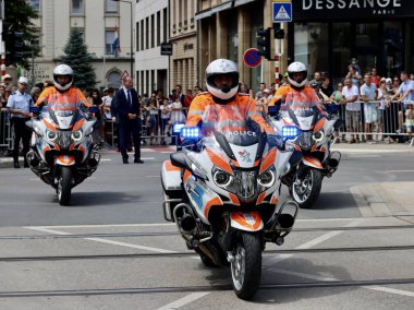 Police motorcycles driving to National day parade. Luxembourg, Luxembourg - June 23, 2022. Selective focus