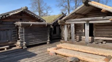Panning inside courtyard of Araishi lake wooden fort on a sunny spring day. Gauja National Park in Cesis region, Latvia - May 9, 2021