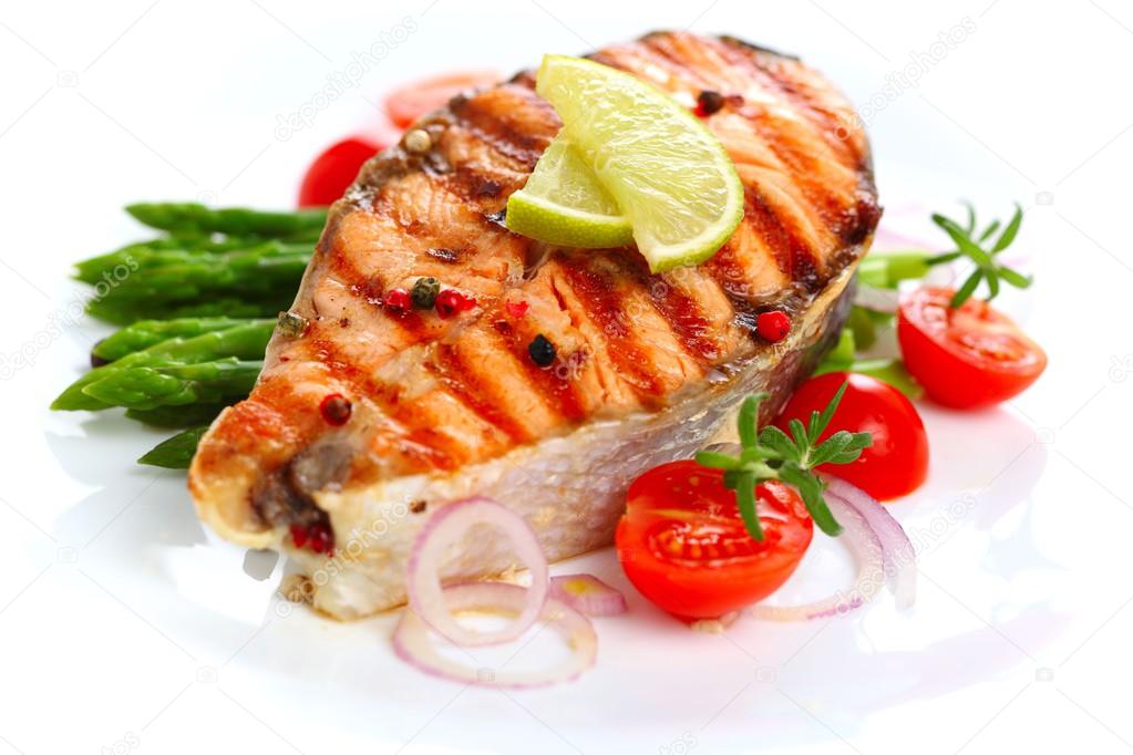 Salmon steak on grilled vegetables