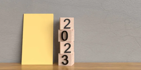 Wooden cube 2023 happy new year merry christmas notebook on table business goal planning vision creative idea strategy solution start calendar check list target deadline diary concept plan success