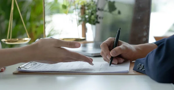 Businessman and lawyer discuss the contract document. Treaty of the law. Sign a contract business