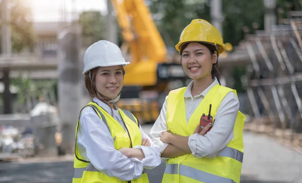 Female construction engineer. Portrait of a young woman working at a construction site