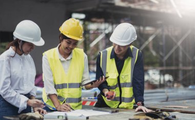 Three experts inspect commercial building construction sites, industrial buildings real estate projects with civil engineers, investors use laptops in background home, concrete formwork framing