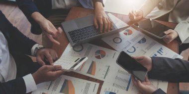 Business adviser analyzing financial figures denoting the progress in the work of the compan