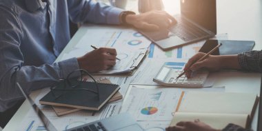 Business people are meeting for analysis data figures to plan business strategies. Business discussing concep