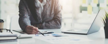 Business people or accountants are analyzing graphs on finance, investment, graph chart business strategy ideas, data analysis technology