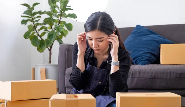 Asia people young woman thoughtful looking away doubtful stress worry in bad news financial economy recession cash flow crisis in small SME issue impact from covid coronavirus at home office store