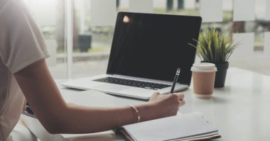 Picture of woman hand filling in invoice paper,Online Taxes And Invoice Billing Electronic Management